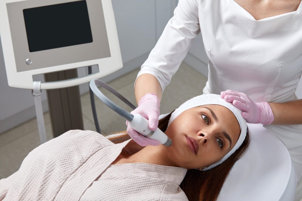 Woman getting facial treatment