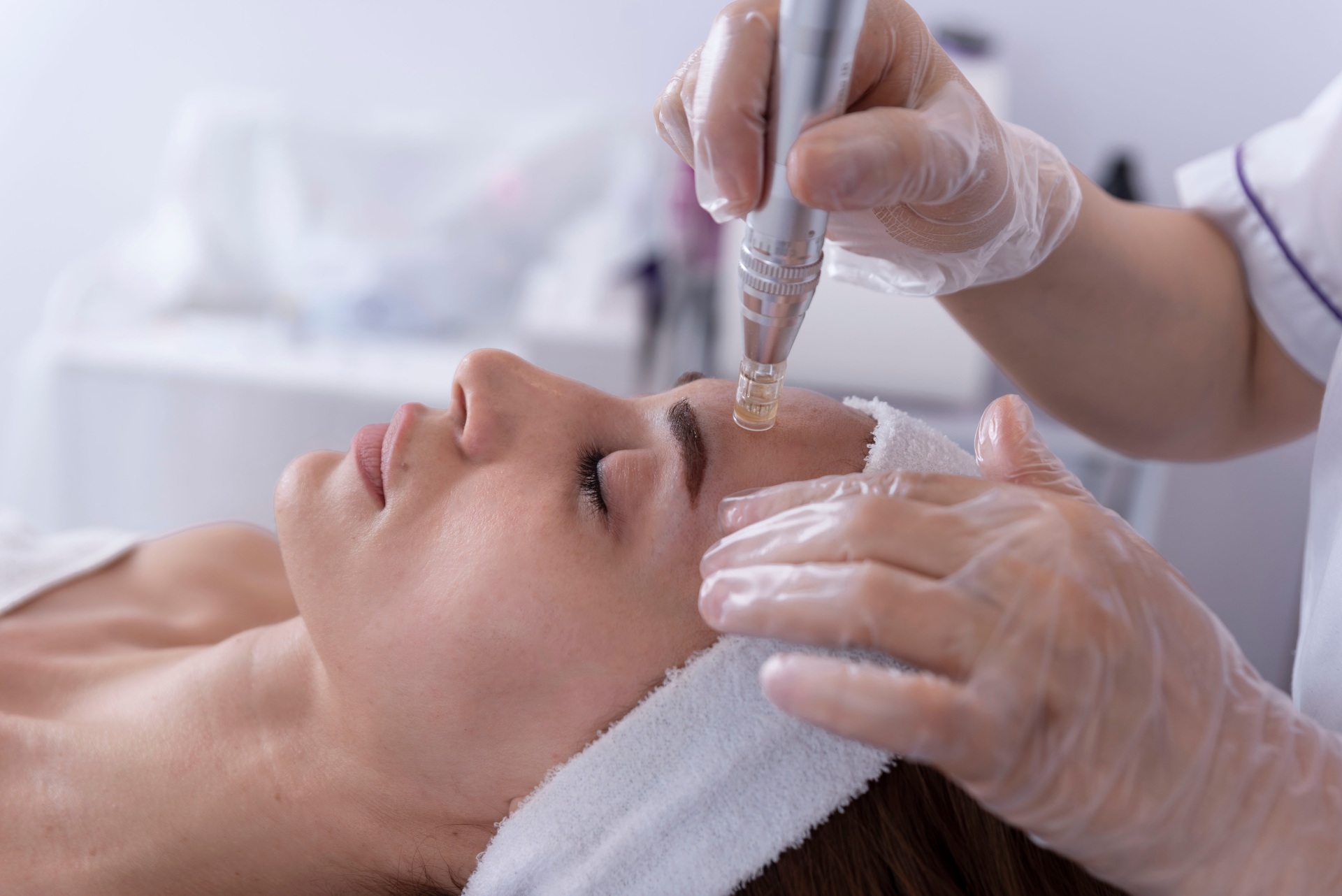 Woman getting facial treatment