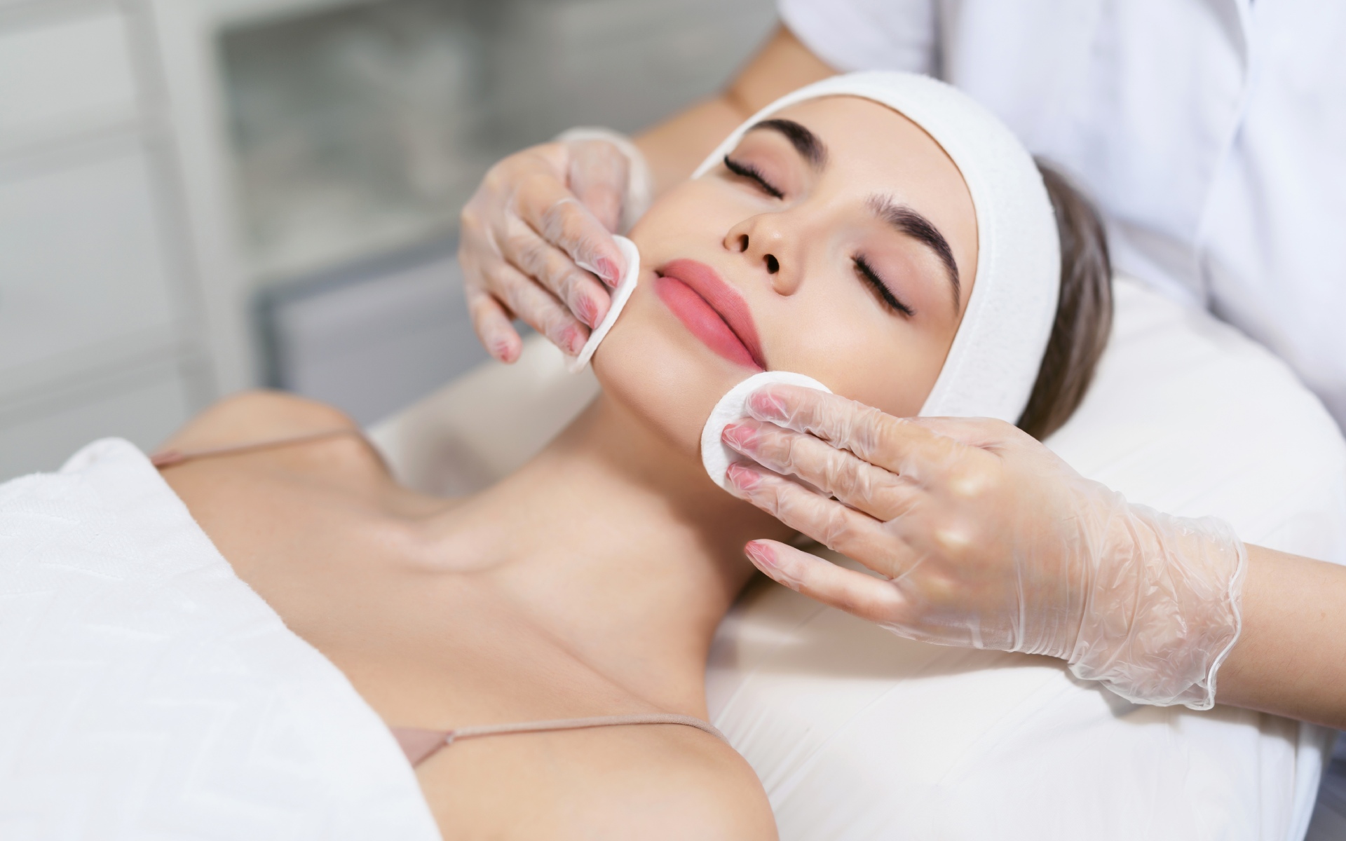 Woman getting facial treatment